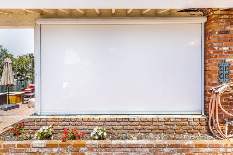 white outdoor shades on home's exterior